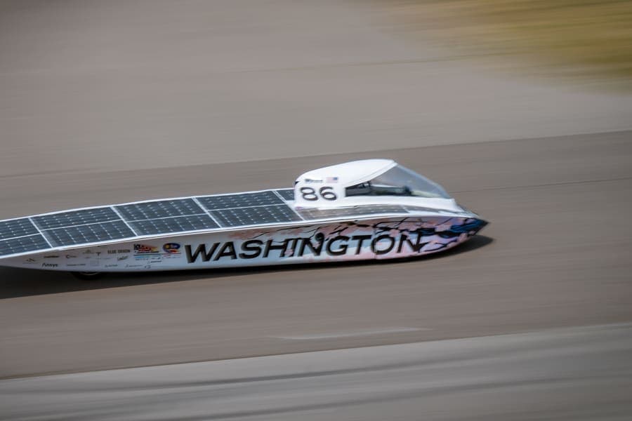 The Washington Solar Car team and their car during the 2026 race season