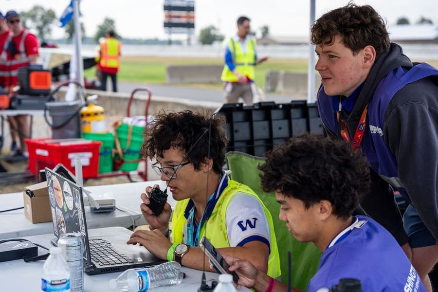 The Washington Solar Car team and their car during the 2026 race season