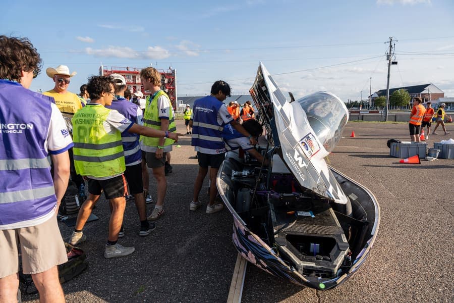 The Washington Solar Car team and their car during the 2026 race season