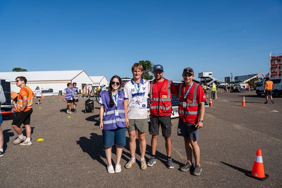 The Washington Solar Car team and their car during the 2026 race season