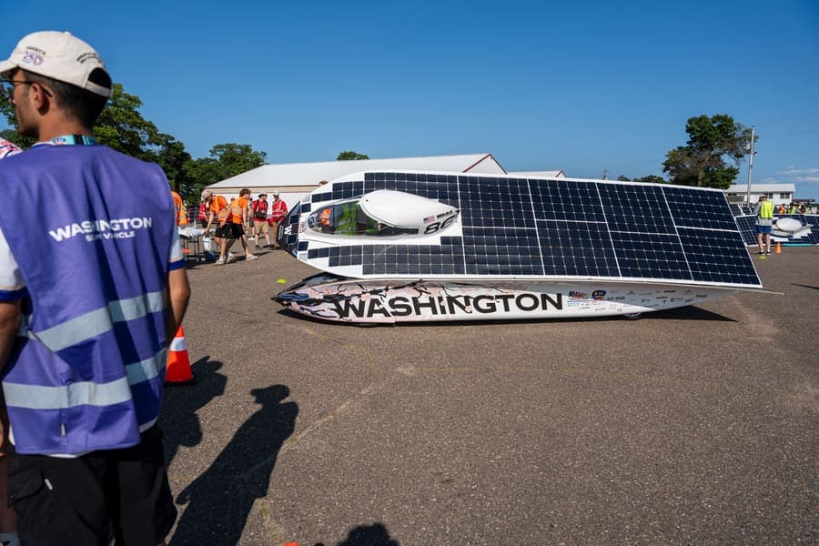 The Washington Solar Car team and their car during the 2026 race season