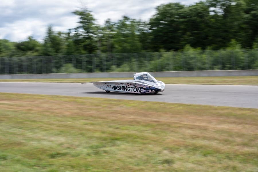 The Washington Solar Car team and their car during the 2026 race season