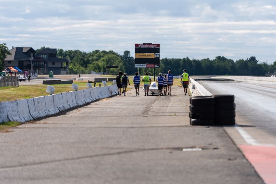 The Washington Solar Car team and their car during the 2026 race season
