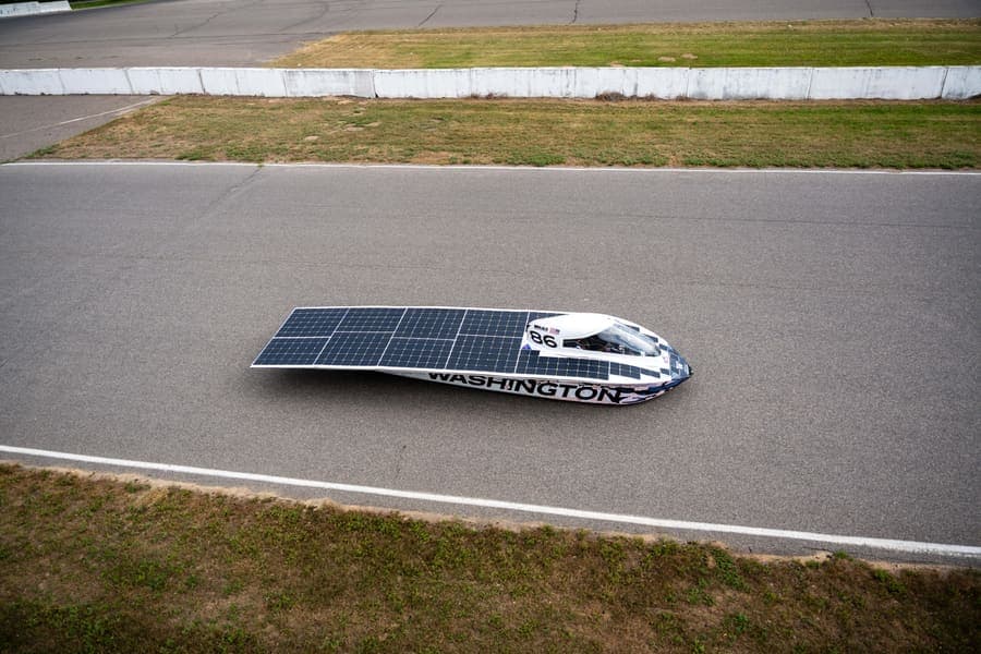 The Washington Solar Car team and their car during the 2026 race season