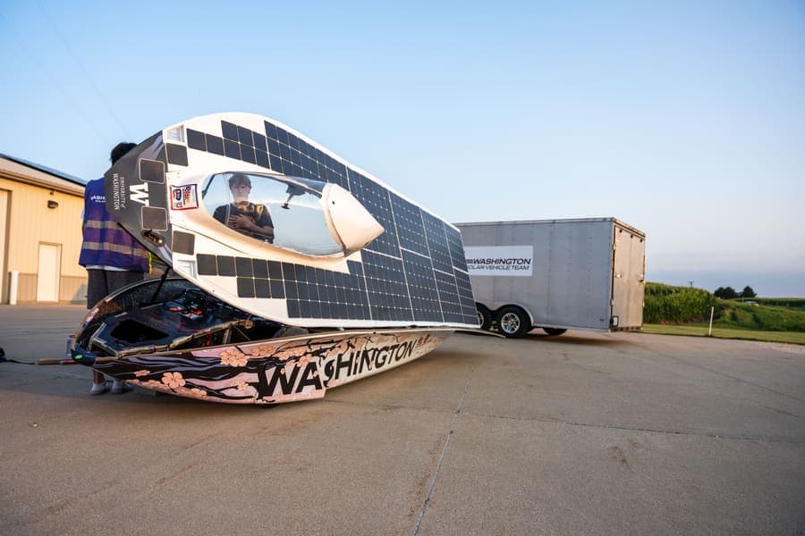 The Washington Solar Car team and their car during the 2026 race season