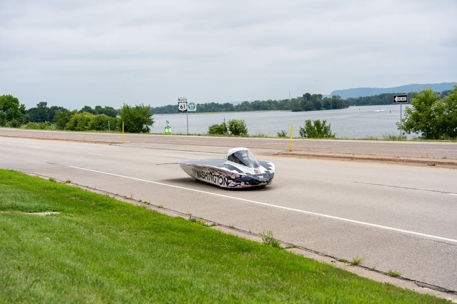The Washington Solar Car team and their car during the 2026 race season