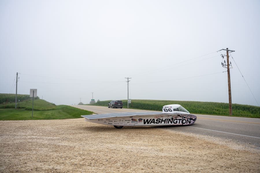 The Washington Solar Car team and their car during the 2026 race season