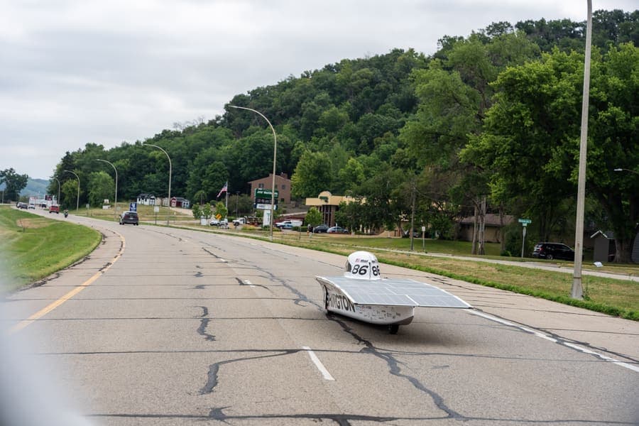 The Washington Solar Car team and their car during the 2026 race season