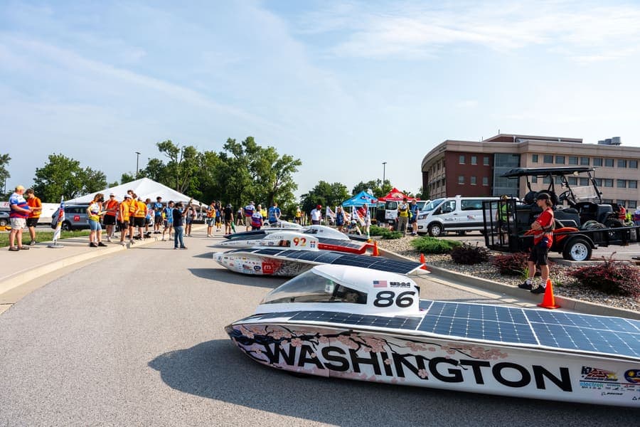 The Washington Solar Car team and their car during the 2026 race season