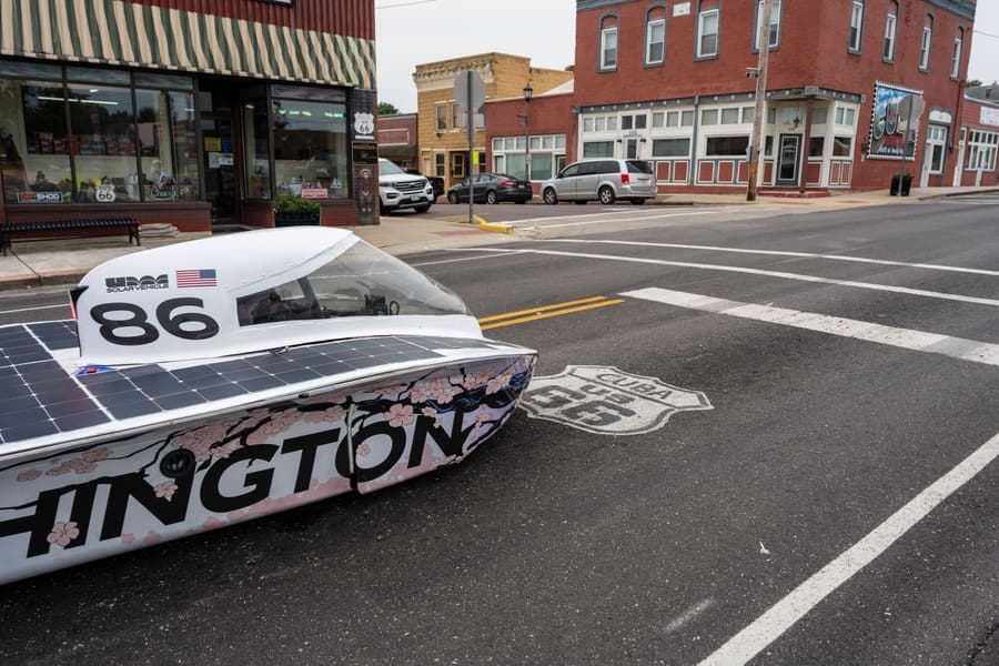 The Washington Solar Car team and their car during the 2026 race season