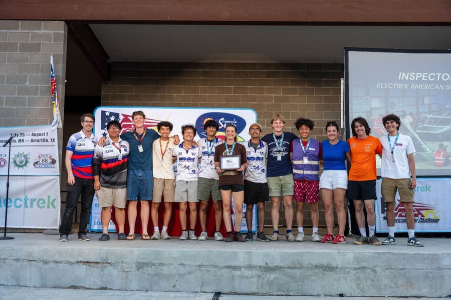 The Washington Solar Car team and their car during the 2026 race season
