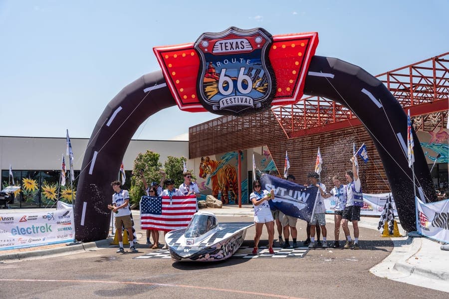 The Washington Solar Car team and their car during the 2026 race season