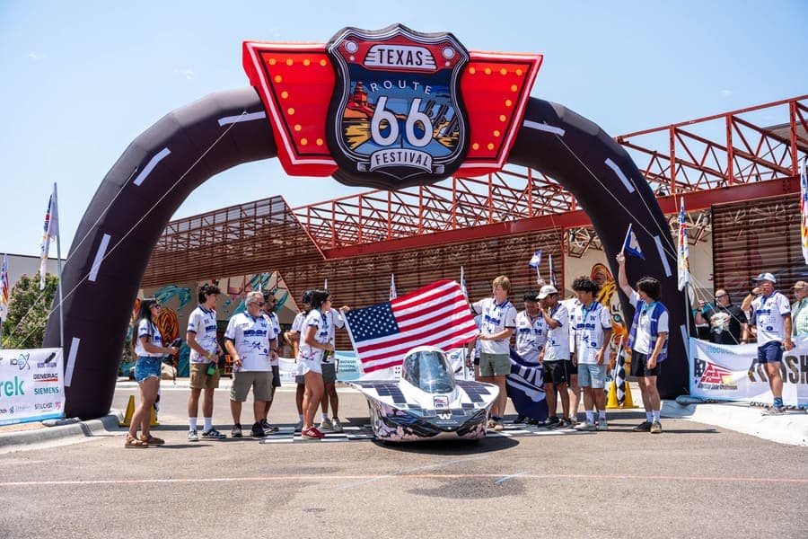 The Washington Solar Car team and their car during the 2026 race season