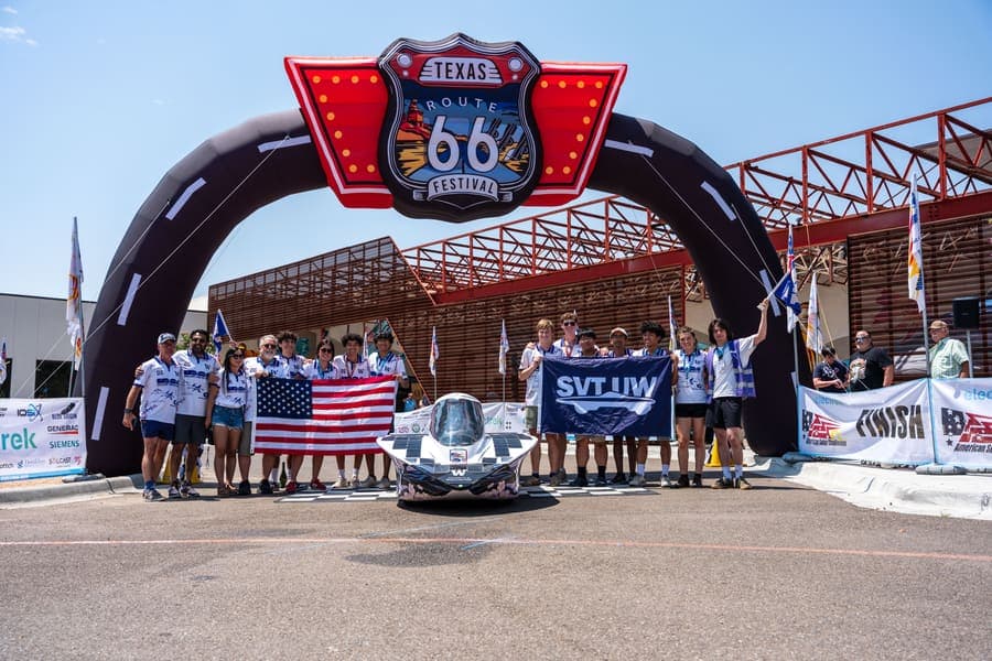 The Washington Solar Car team and their car during the 2026 race season