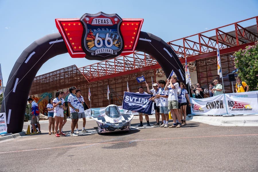 The Washington Solar Car team and their car during the 2026 race season